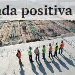 seven construction workers standing on white field